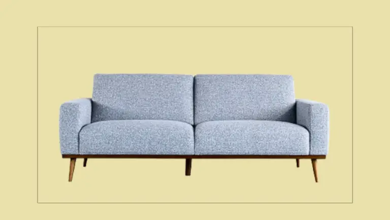 a couch with a yellow background